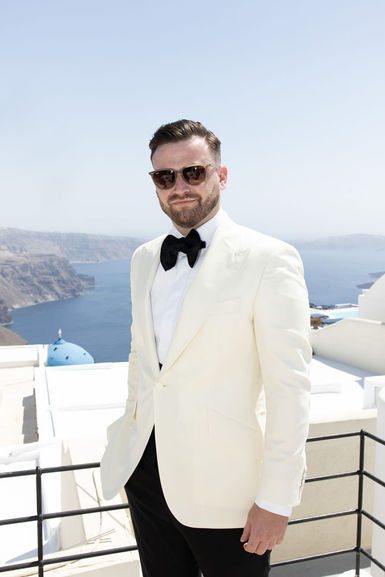 Groom portrait captured at El Viento Santorini in direct flash