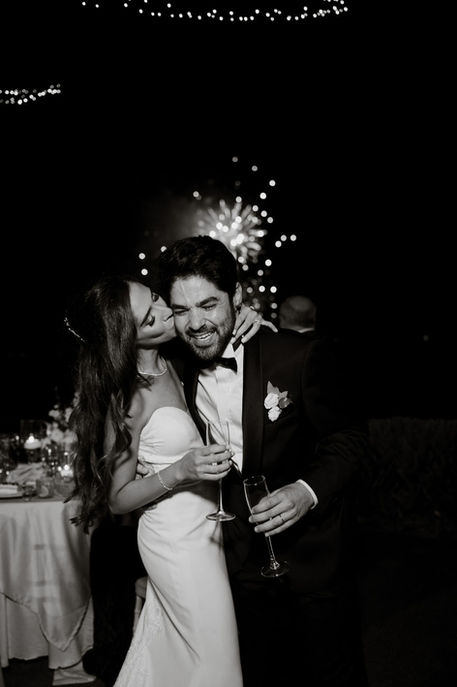 Couple kissing during reception