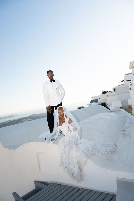 Fashion- forward caldera wedding in Santorini Greece