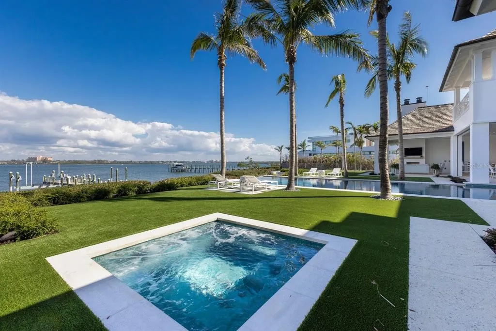 Private deep-water dock with mooring space for a 34-foot boat and direct access to the Gulf of America