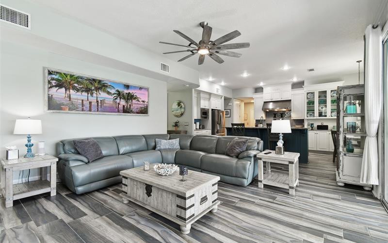 Elegant living room with hand-scraped wood floors and gas fireplace