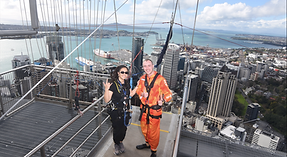 Alex Nelson poses on top of the Sky Tower in New Zealand