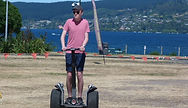 Alex Nelson rides a Segway scooter