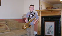Alex Nelson poses with his saxophone