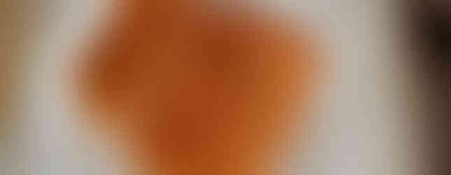 Raw, seasoned salmon on a white plate