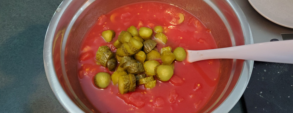 Chopped dill pickle added to gazpacho