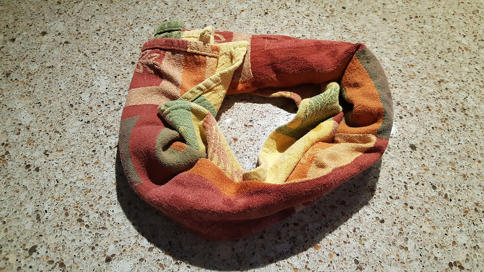 Towel forming a donut on a counter