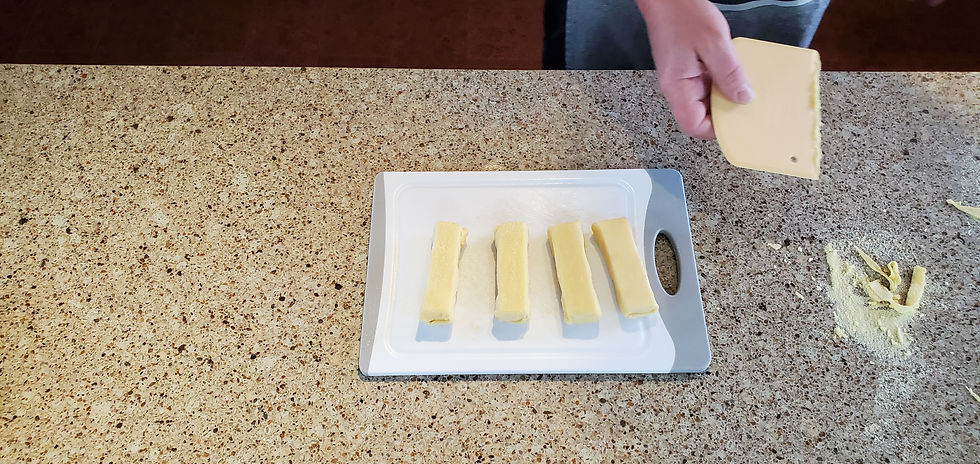 Cheese wraps drying on a white plate