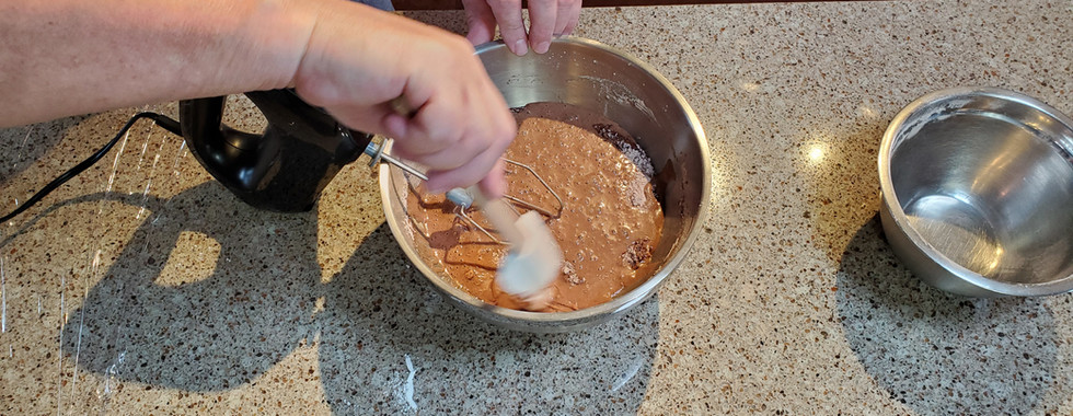 Use a spatula to remove dry mix that may be stuck to the sides and bottom of the bowl
