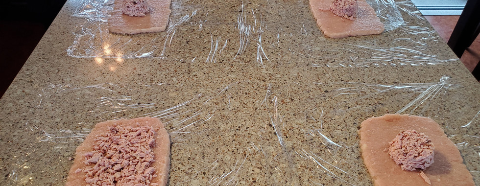 evenly distribute 60-70 grams (~⅓ cup) of the ham mixture, leaving about 1” around all without any ham.