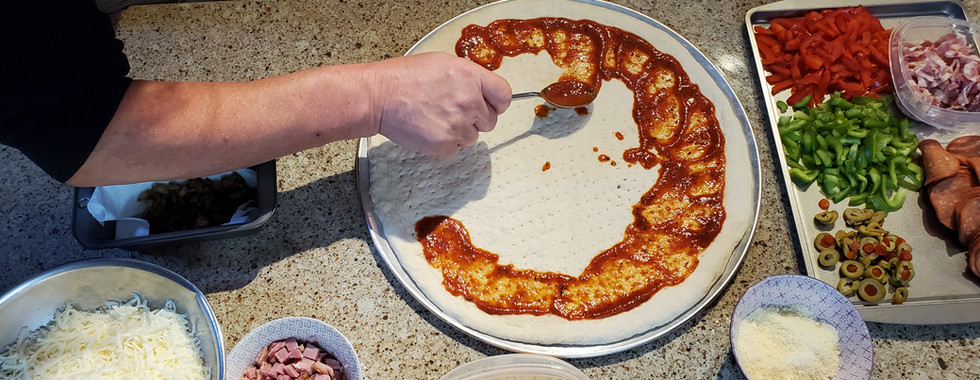 Push the sauce from the edges toward the center.