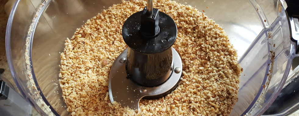 Almonds and hazel nuts in a food processor