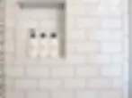A photo of a shower room using white subway tiles.