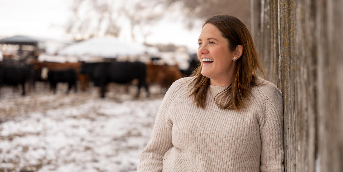 Janette standing outside in the winter as she takes a break from your client work for Roots and Revenue