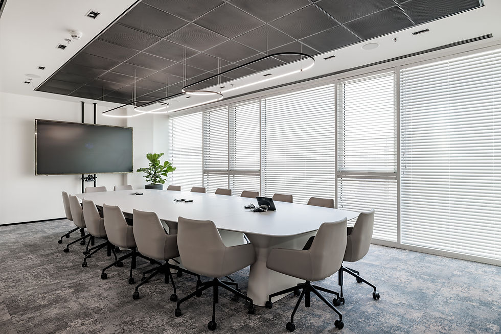 Eye-level view of a hybrid office meeting room with video conferencing setup