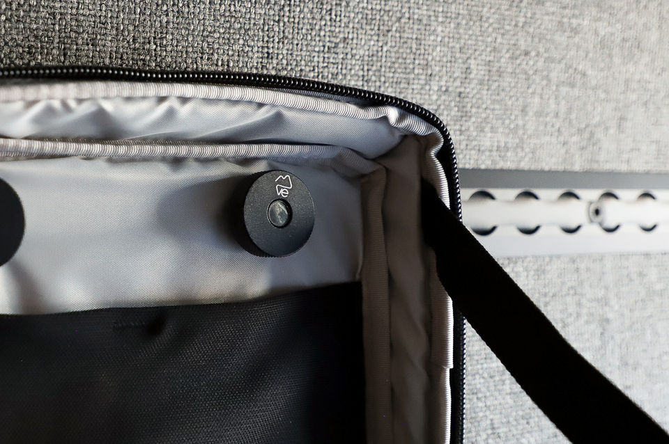 Close-up of bag interior with black magnetic closures