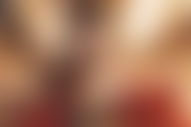 An anime girl with golden and red attire