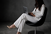 Professional woman in minimlaist studio.png