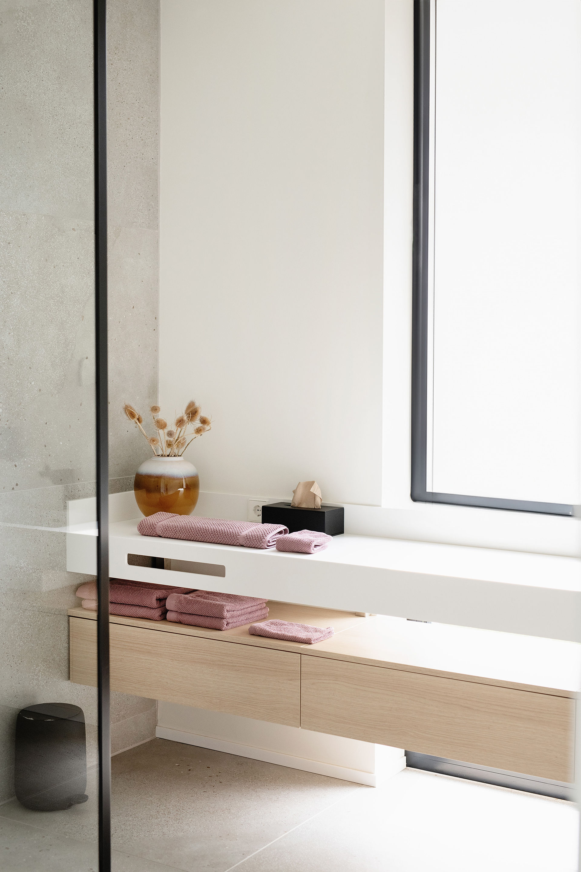 A clean bathroom featuring a modern sink, toilet, and a spacious shower for a refreshing experience