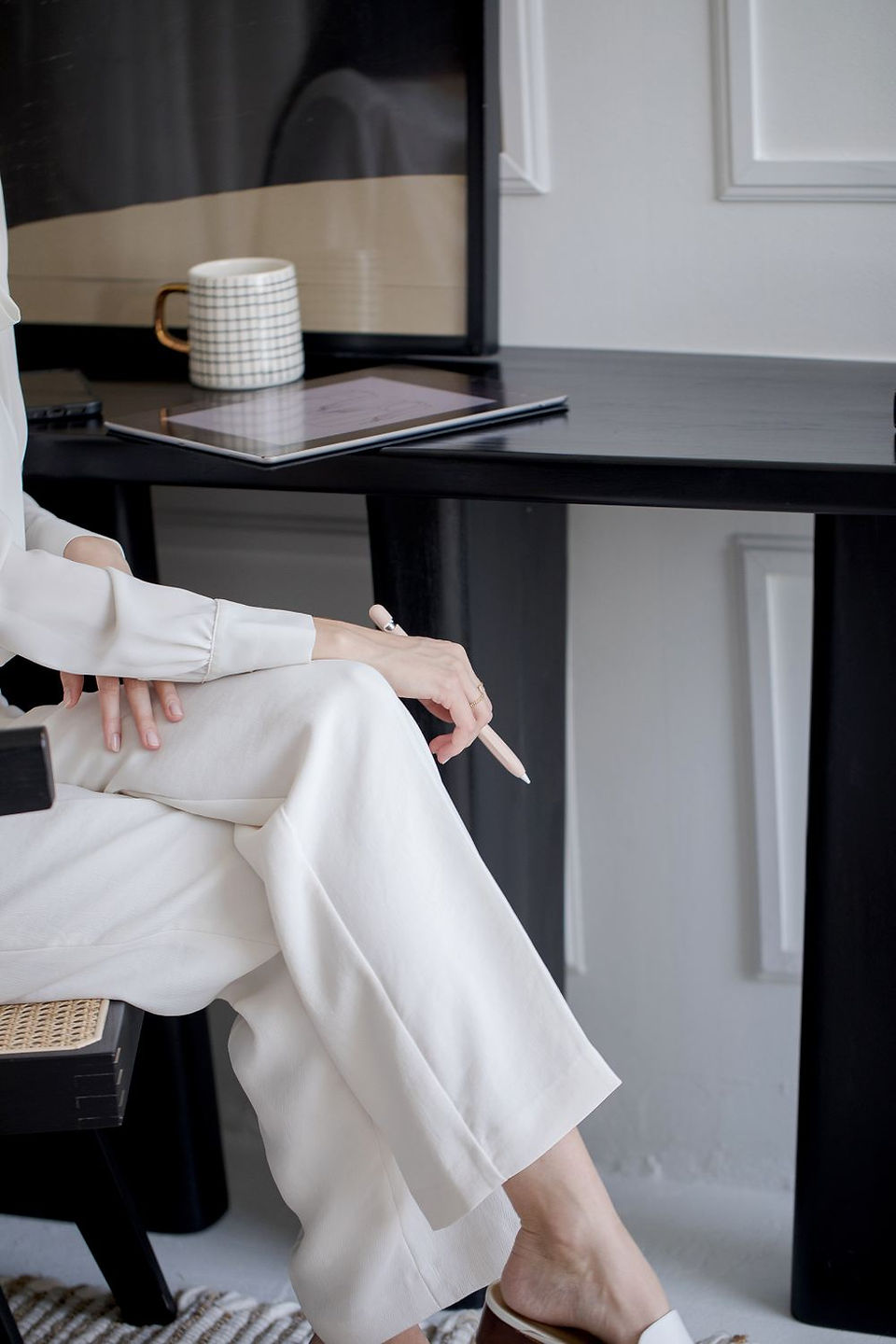 well dressed business woman sitting in front of desk