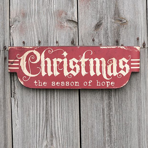 metal christmas sign on wall