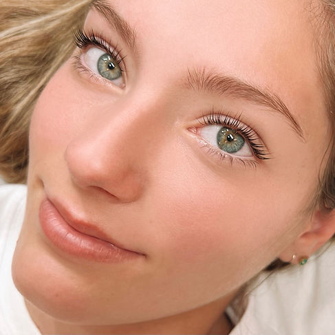 smiling woman with long lashes