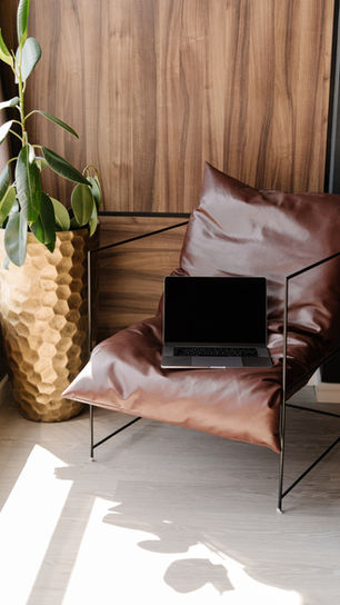 swanky brown leather chair in office setting