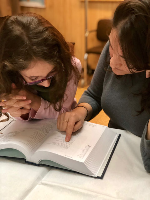 Cantor Laura Stein giving a Bat Mitzvah lesson to a young woman in Westchester, New York