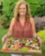 Heather Stickler holding tray of meats and cheeses