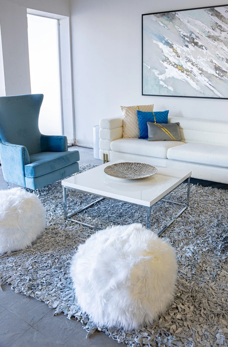 blue and white furniture pieces in staged living room