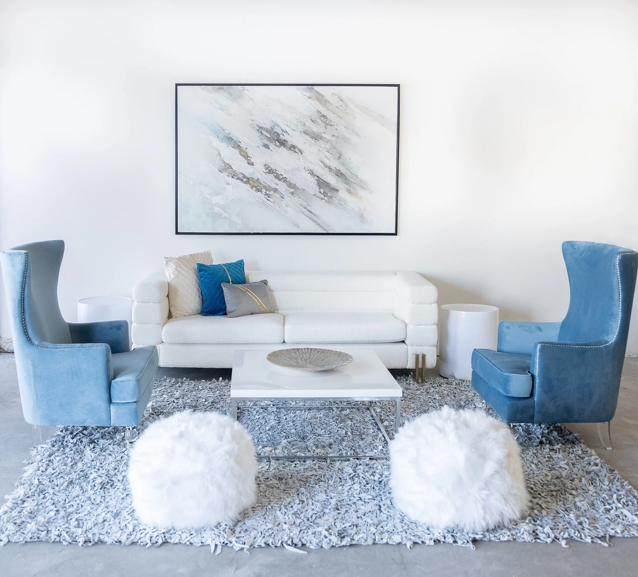 staged living room in blue and white accent pieces