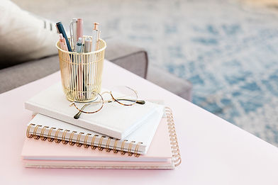 pink workspace with pens