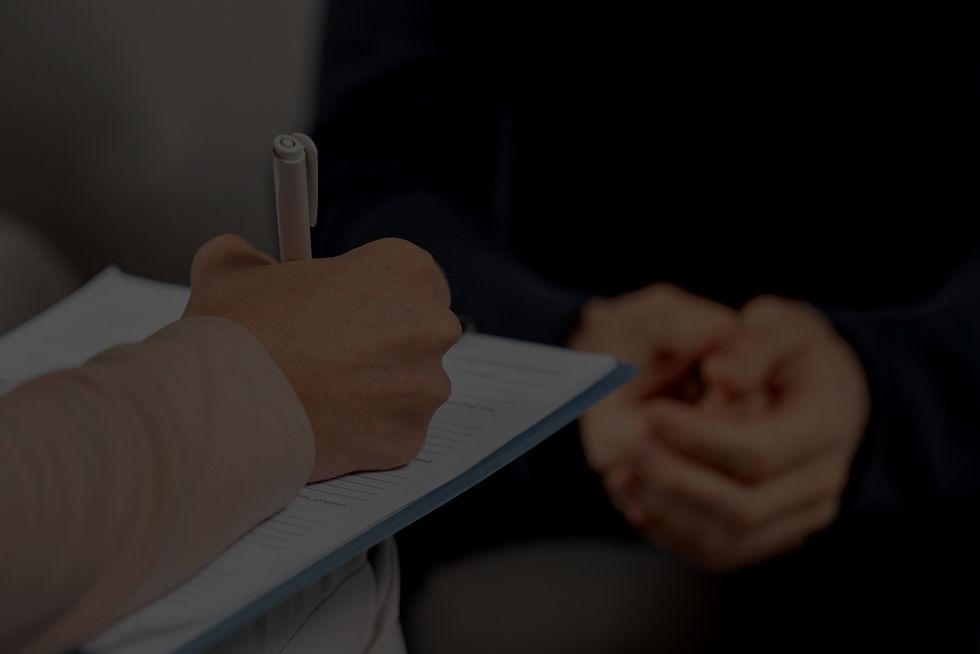 mid-shot-woman-therapist-taking-notes-in-clipboard_edited_edited.jpg