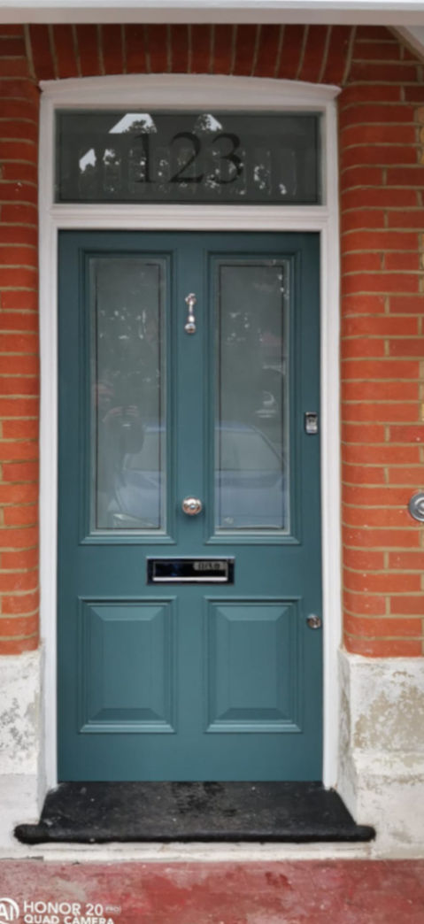Bespoke Victorian front doors London with a pristine white frame and sandblasted glass.