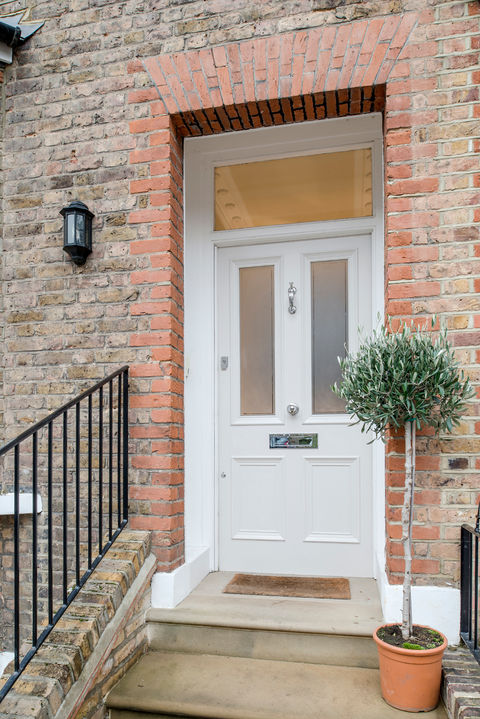Four panel Victorian front door with sandblasted glass and polished chrome furniture