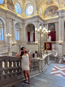 Jennifer at elegant palace interior in Madrid, Spain showing European cultural destination expertise