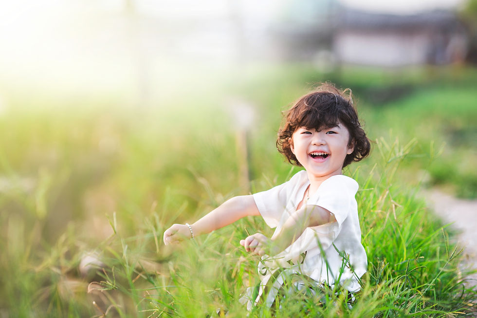 smiling-girl-sitting-grass.jpg