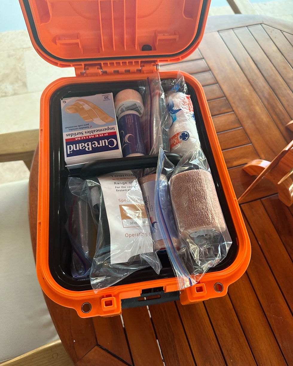 Close-up view of a first aid kit filled with essential supplies for boating emergencies