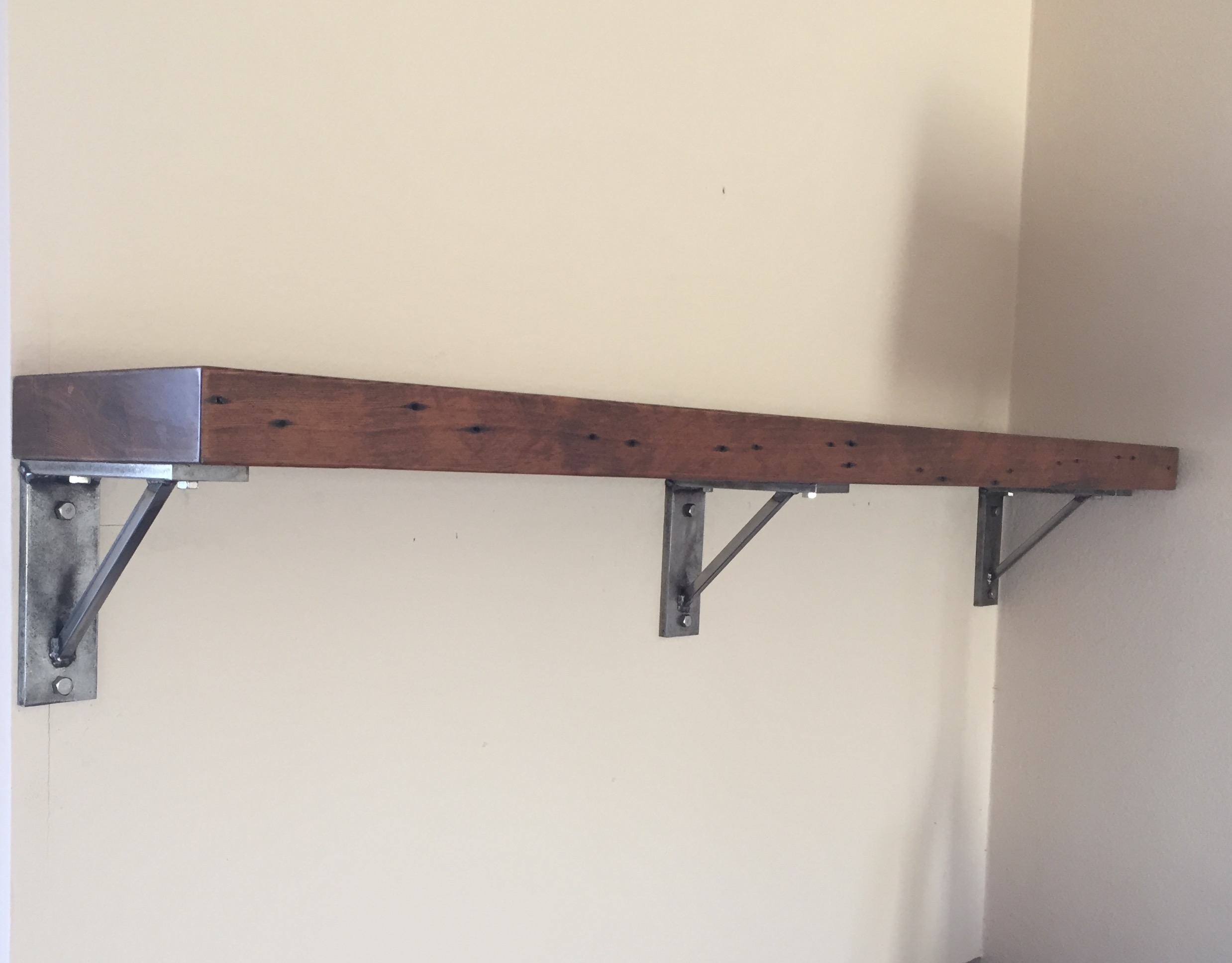 Mantel with steel brackets