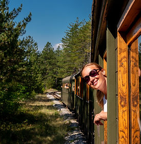 caucasian-woman-looking-out-from-train-window.jpg