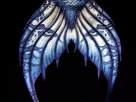 Blue Mermaid tail fluke, design detail, on black background