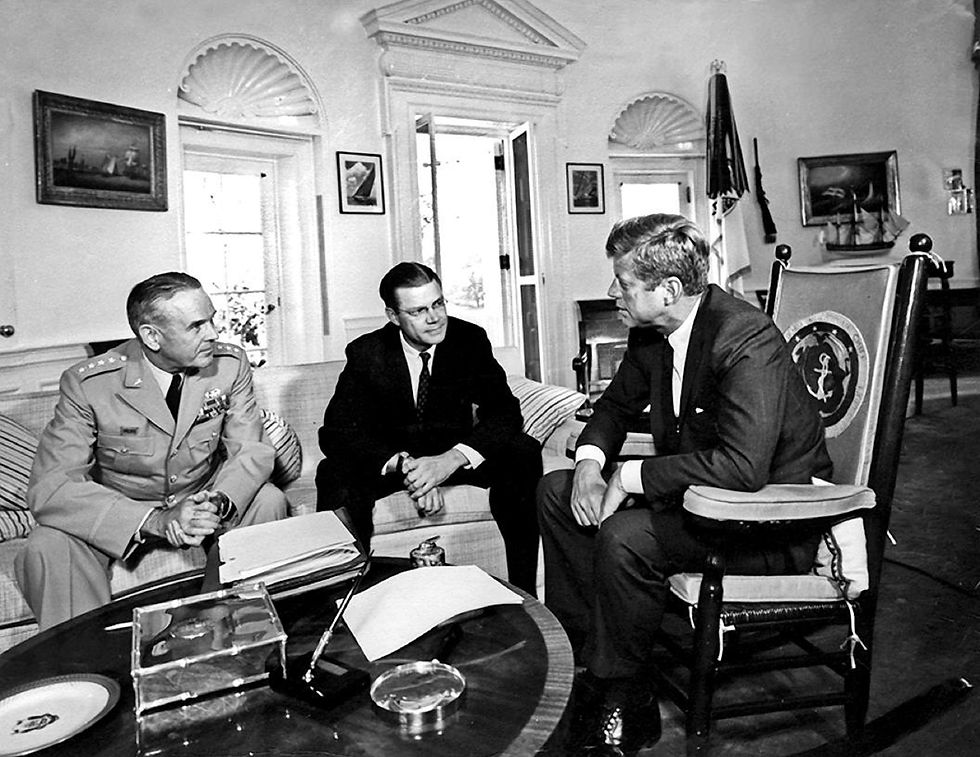 President John F. Kennedy meets with the Chairman of the Joint Chiefs of Staff Gen. Maxwell D. Taylor and Defense Secretary Robert S. McNamara at the White House on Oct. 2, 1963.