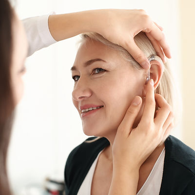 AdobeStock_208255477 hearing aid fitment.jpeg