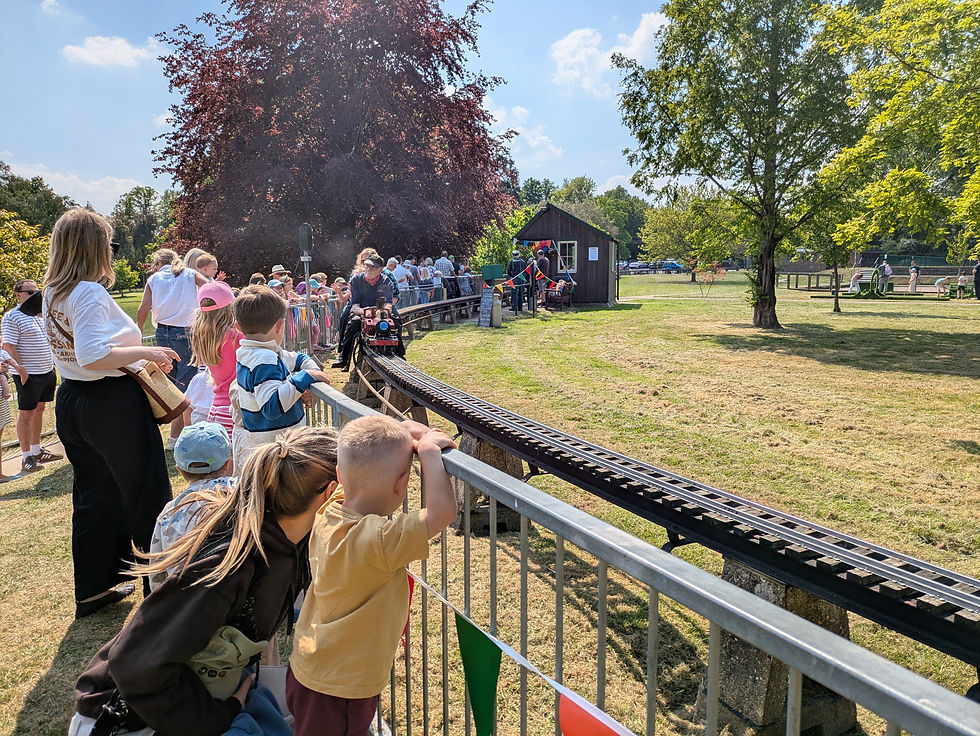 Residents crowded round in excitement to take a train ride at the Beech Hurst Miniature Railway's 75th Anniversary