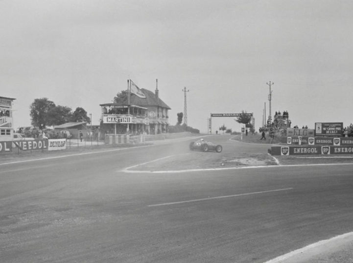 1959 Monaco Grand Prix car racing on track past grandstands