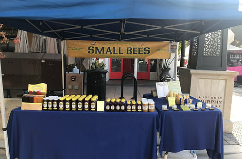 Small Bees market stall with honey and beeswax products
