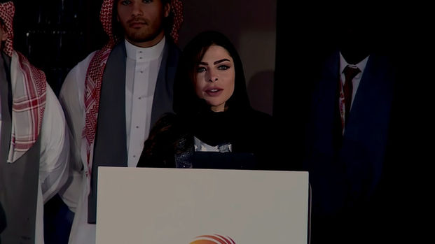 Dalma speaking at conference in Muscat