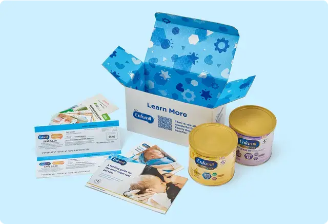 Open Enfamil-branded box with blue interior pattern contains formula cans, coupons, and brochures. Text reads "Learn More." Light blue background.