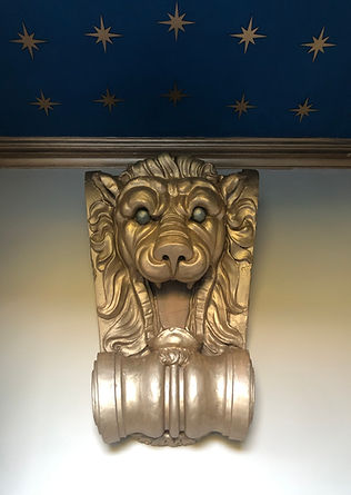 Restored theatrical lion and celestial ceiling in the porch