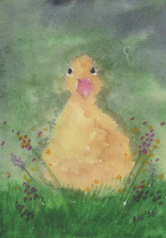 fuzzy yellow duckling on lush green background of grass and wildflowers